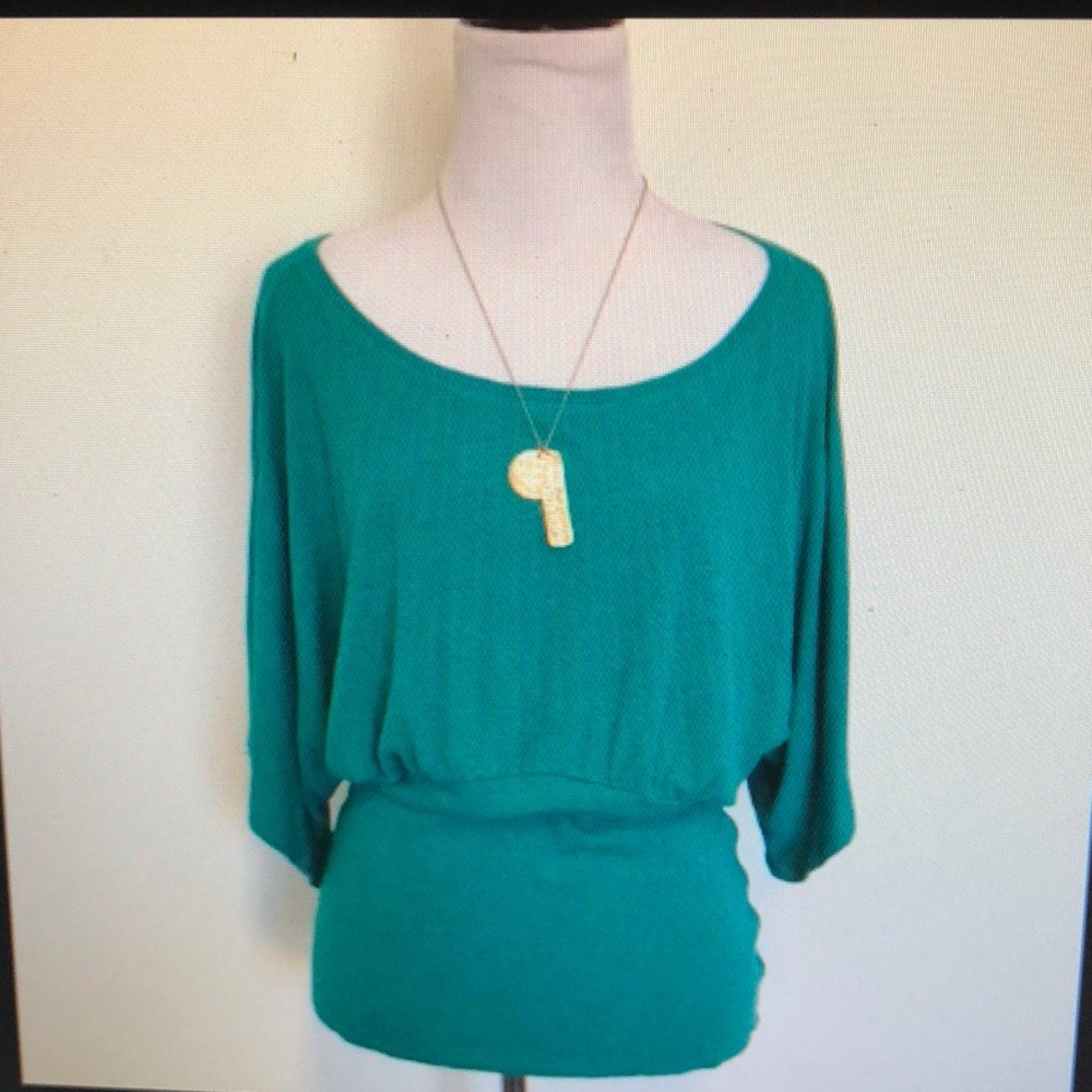 Bordeaux for Anthropology dark teal sweater.